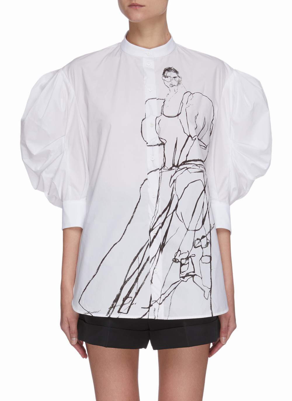 饰以Dancing Girls图案的Alexander McQueen白色恤衫/$9,100/Lane Crawford,配搭Balloon Sleeve衣袖设计,倍添女士韵味。