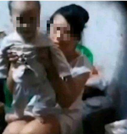 吳女與兒子。網圖