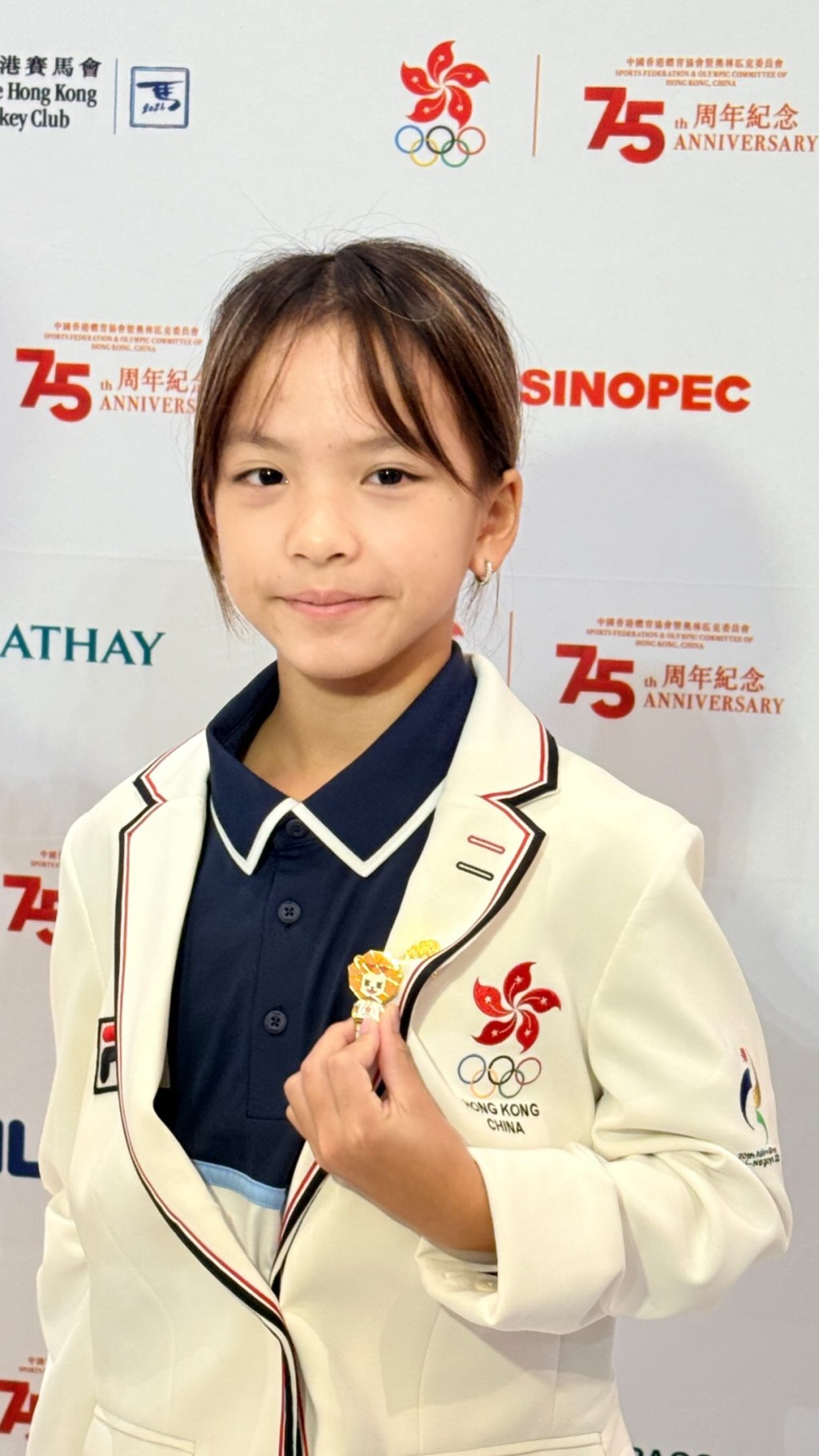 萱萱在名古屋亞運開幕當天剛好12歲,不但壓線符合參賽資格,亦成為今屆中國香港亞運代表團最年輕選手。(受訪者提供) 萱萱在名古屋亞運開幕當天剛好12歲,不但壓線符合參賽資格,亦成為今屆中國香港亞運代表團最年輕選手。(受訪者提供)