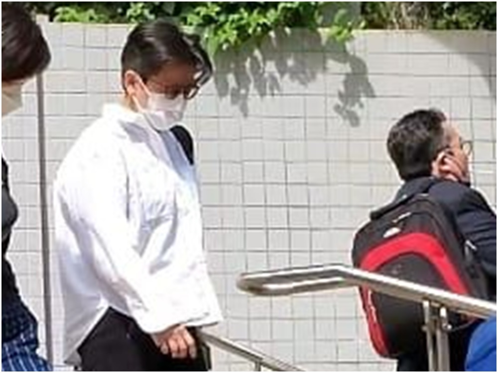证人保安员黎玉钿（白衣者，音译）。