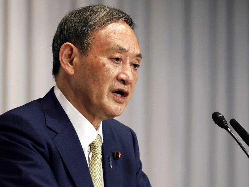 菅義偉已獲黨內三分之二的議員支持，處於領先位置。AP圖