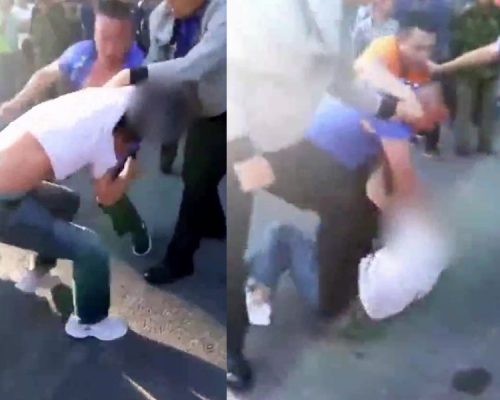 哈爾濱城管毆打一名小販,一名路人上前阻止(橙衣者),也被他們打了一頓。 (網圖)