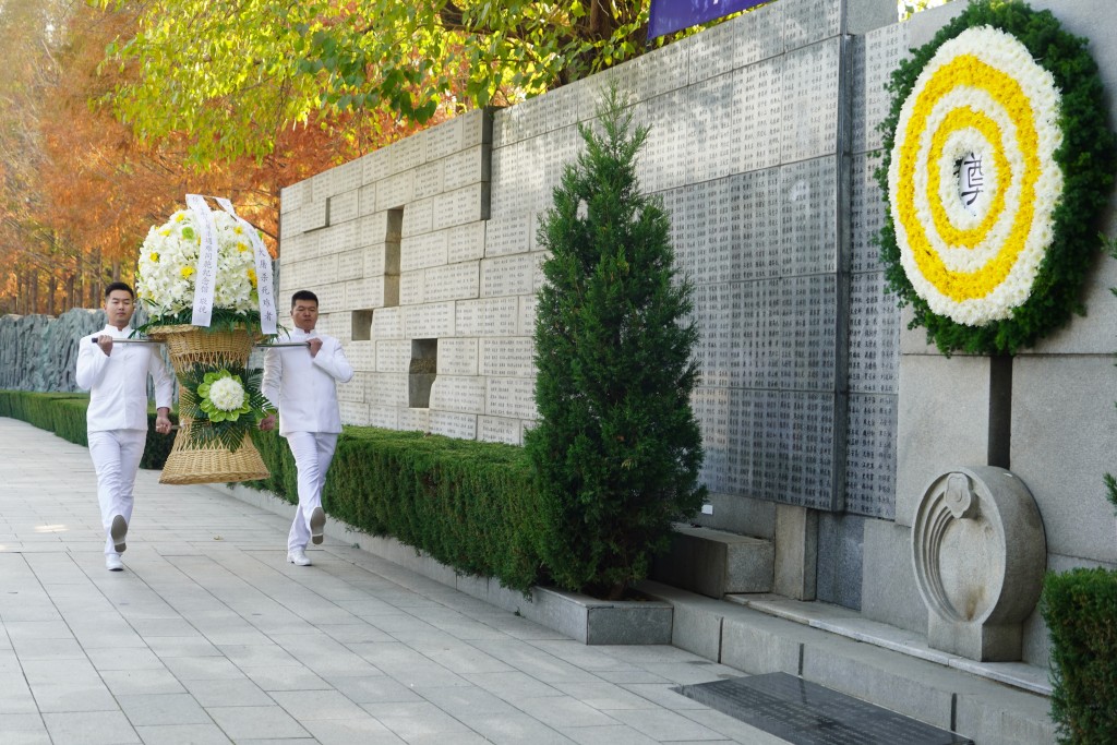 南京大屠殺死難者家庭祭告活動。新華社