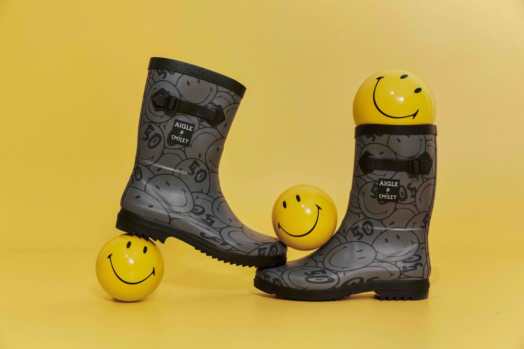 品牌與 Smiley合推的女裝靴/$1,680，靴身飾以法國街頭塗鴉藝術家Mr. A（André Saraiva）為Smiley設計的五十週年紀念標誌的圖案。