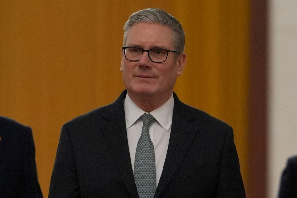 施紀賢在北京人民大會堂與習近平會晤。 路透社 