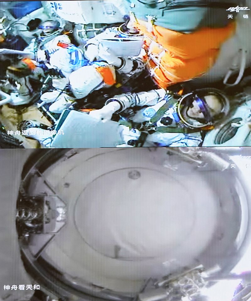 3名航天员正进行一系列的检查工作。新华社