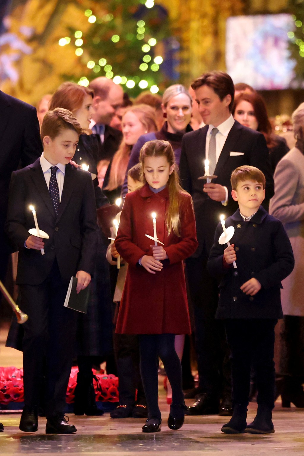 （左起）喬治王子、夏洛特公​​主和路易王子，出席皇妃凱特主持的耶誕頌歌音樂會。 路透社