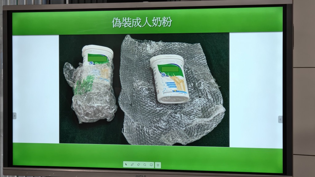 成人奶粉樽內藏有850克依托咪酯粉。黃文威攝