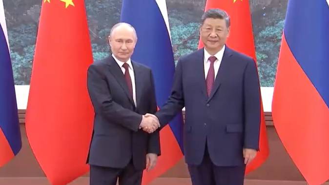 習近平同俄羅斯總統普京握手合影。 習近平同俄羅斯總統普京握手合影。