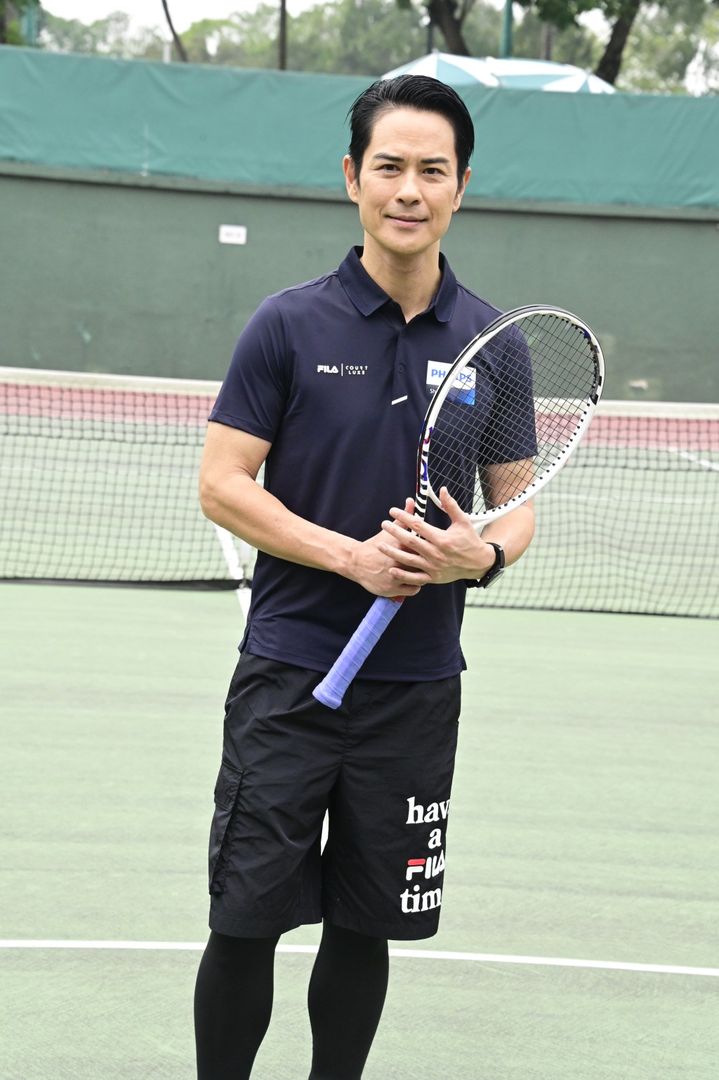 郑嘉颖14日出席支持网球公开赛活动。