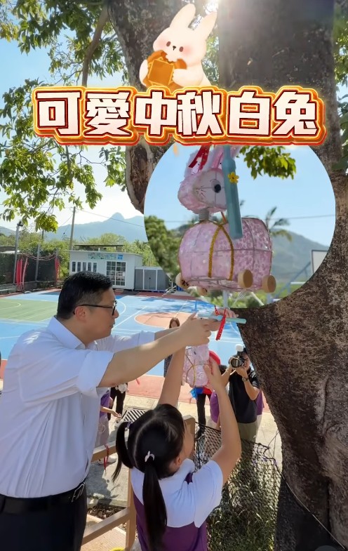 鄧炳強與小學生一齊掛燈籠佈置學校樹屋。鄧炳強fb影片截圖