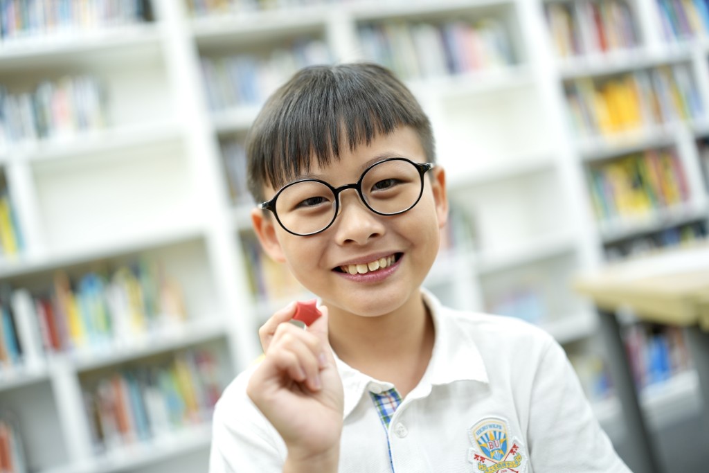 香港浸會大學附屬學校王錦輝中小學的小四生梁智仁。劉駿軒攝