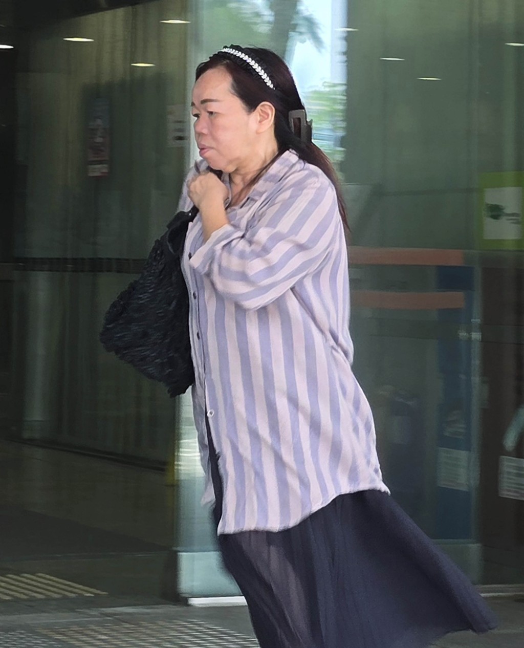 62岁收银员马丽卿在庭上求情称已知错，会重新做人。王仁昌摄