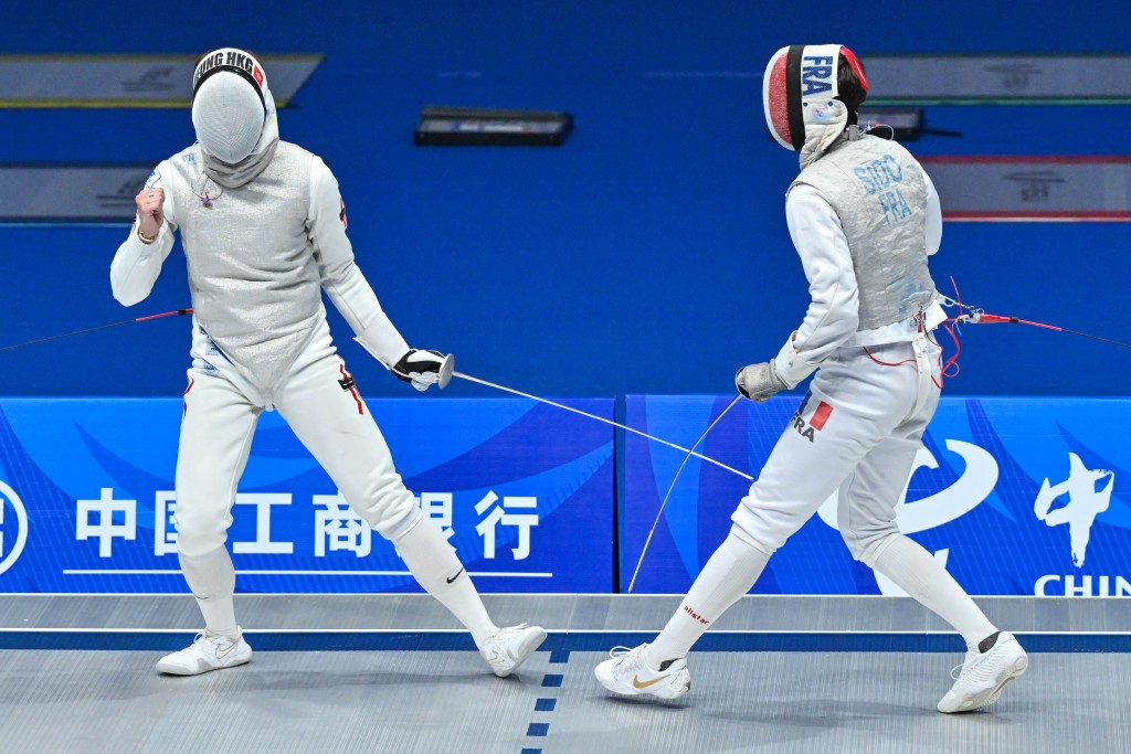 张家朗（左）坦言团体赛夺冠比个人赛更开心。
