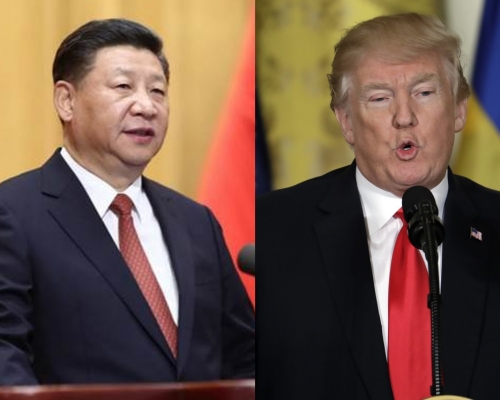 習近平(左)讚揚特朗普(右)有積極誠意解決問題。
