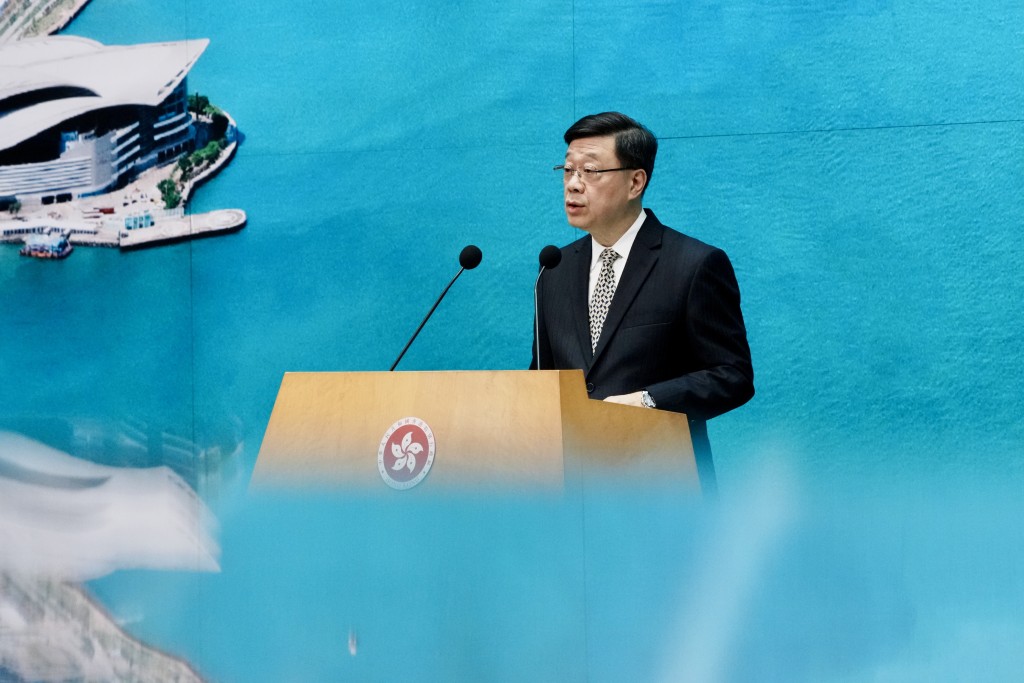 李家超出席行會前見記者。汪旭峰攝