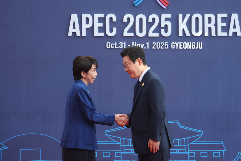 高市早苗與李在明。美聯社