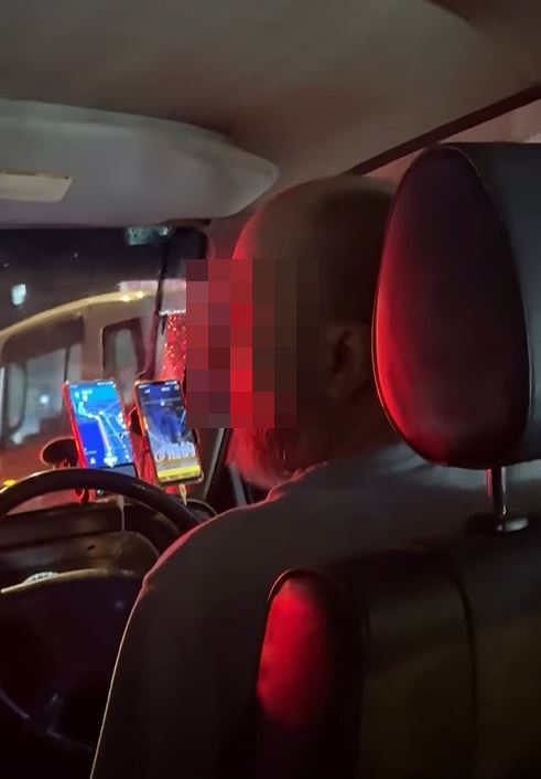 的士司機拒絕停止吸煙，與女乘客僵持不下。fb「車cam L（香港群組）」影片截圖