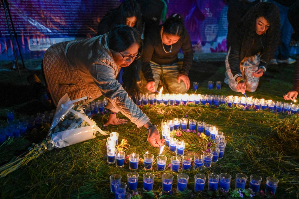危地馬拉婦女悼念被殺的受害人。法新社