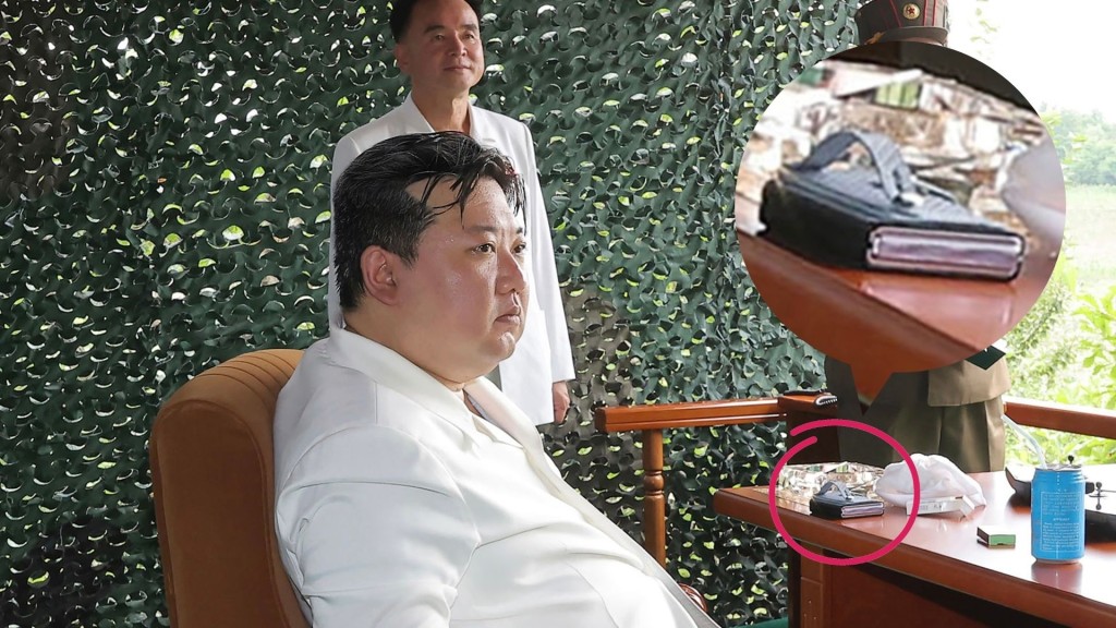 金正恩坐鎮指導「火星-18」新型洲際彈道導彈試射的畫面,桌上疑似放了一部智能摺機。 美聯社