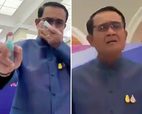 泰國首相巴育用消毒噴霧狂噴記者。