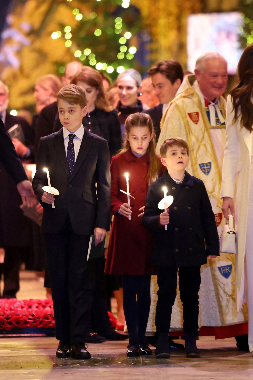 （左起）喬治王子、夏洛特公​​主和路易王子，出席皇妃凱特主持的耶誕頌歌音樂會。 路透社
