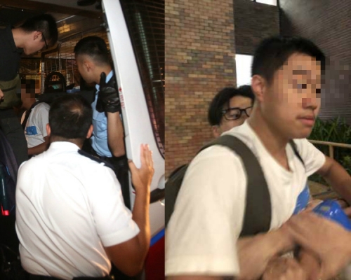 懷疑動手的男子被帶上警車。