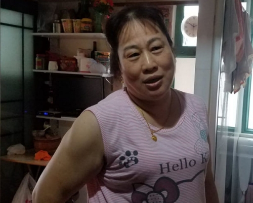 鄰居陳女士。 歐陽偉光