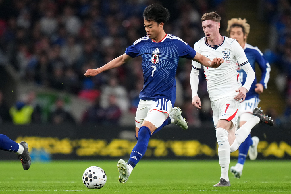 三笘薰終結比克福特的的不失球紀錄。美聯社