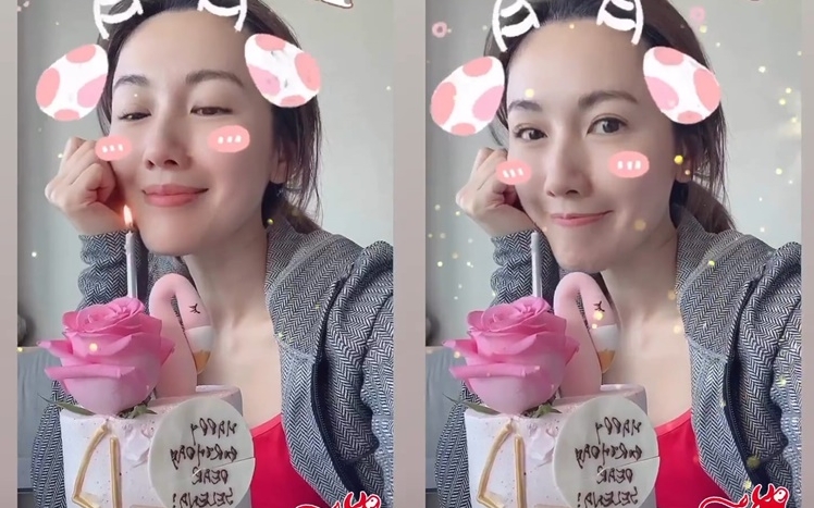 李施嬅的吹蜡蠋照都是自拍，蛋糕字体都反了，似乎是一个人在加拿大庆祝，未婚夫不在身边。