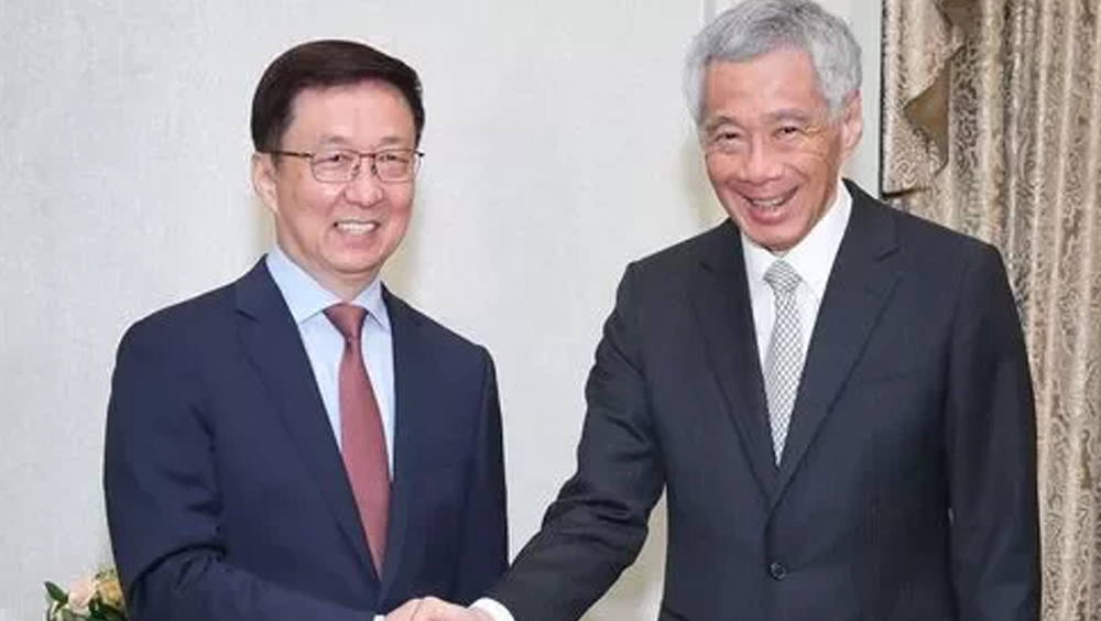 國務院副總理韓正(左)訪問新加坡，與新加坡總理李顯龍會面。FB圖