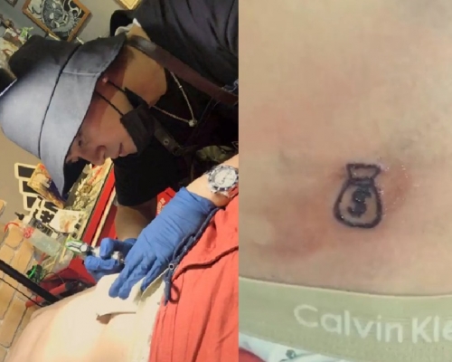 罗志祥一脸认真地帮大根纹身。