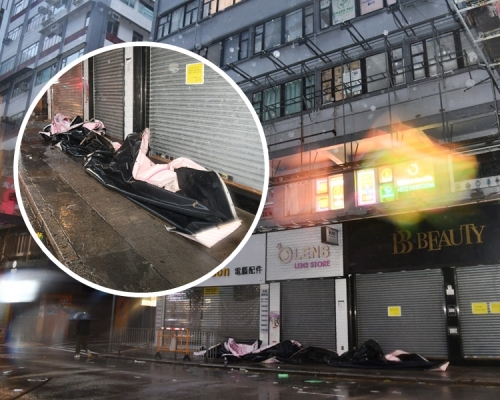 尖沙嘴今晨有大廈外牆招牌被風吹翻並懸吊半空,消防員派人將其移除。