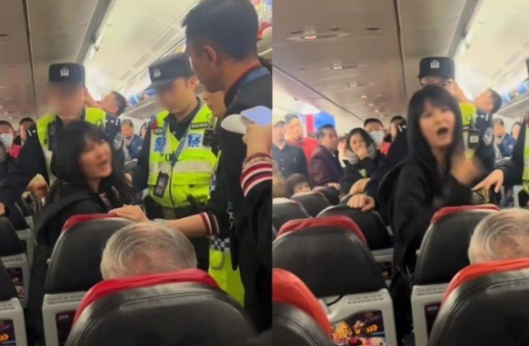 一名女子在飞机座位上表现激动 (图／翻自@Byron_Wan X)