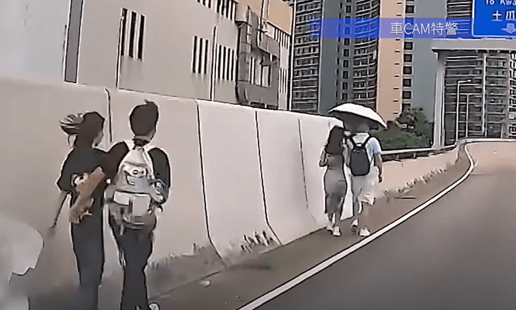 四男女沿着红磡公主道连接路行走。YouTube：车CAM特警