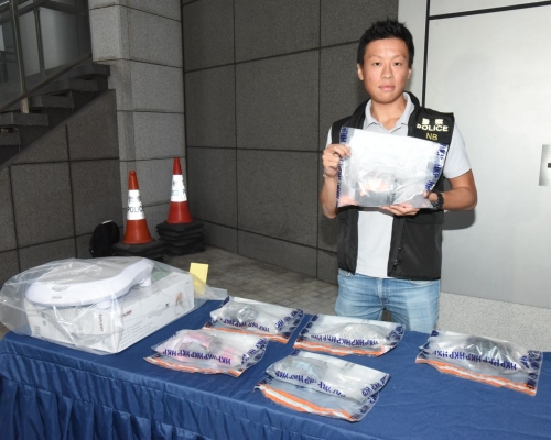警方檢獲證物。徐裕民攝