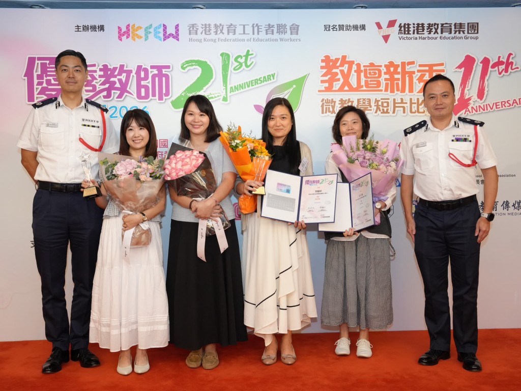 警務處國家安全處處長江學禮、警務處助理處長（國家安全）郭嘉銓與在場一眾不同組別的優秀得獎老師合照。