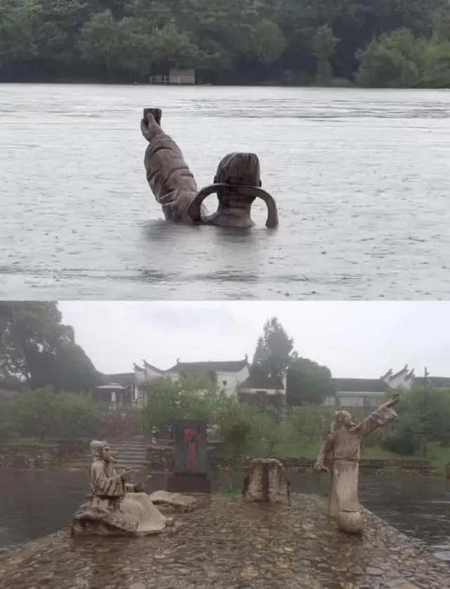 李白的雕像只剩下頭部和一隻手舉著酒杯露出水面。