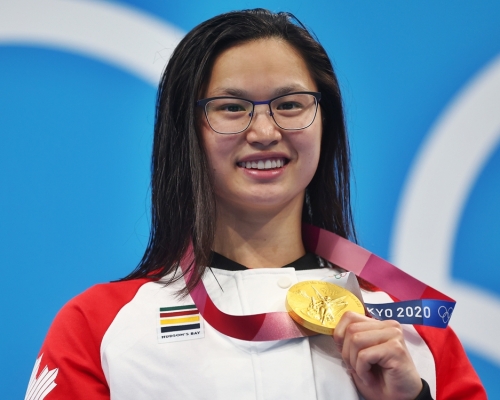 麥妮爾奪得女子100米蝶泳金牌。路透社
