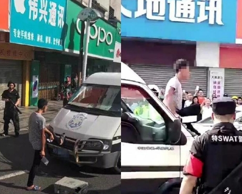 男子在常平鎮東興路持刀攔截路上車輛。網圖