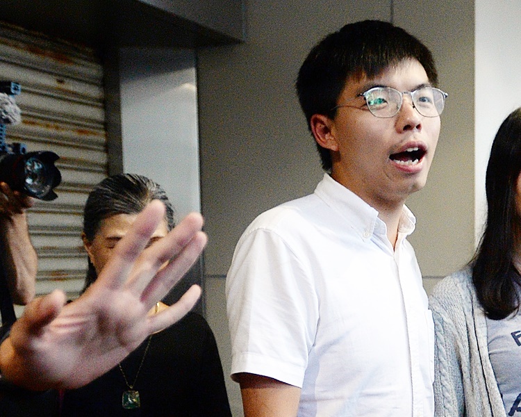 黃之鋒表明不擔心會被警方指他違反保釋條件。資料圖片