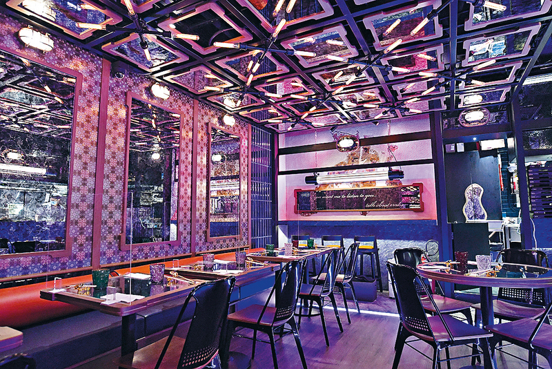 位於尖沙嘴的「上三兩」，主打蟹粉菜式，但用餐環境像家酒吧，配合霓虹燈光管，充滿型格時尚氣氛。