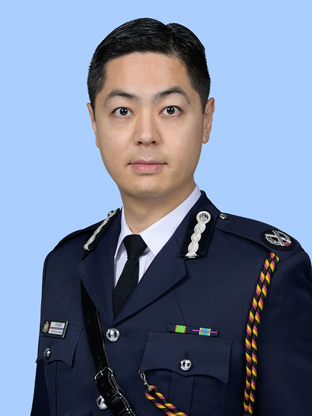 现为港岛总区指挥官郭嘉铨，亦曾任助理处长（公共关系)。
