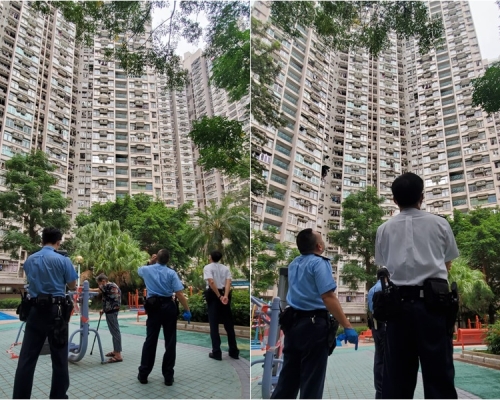 多名警員仰視事發單位位置。 林思明攝