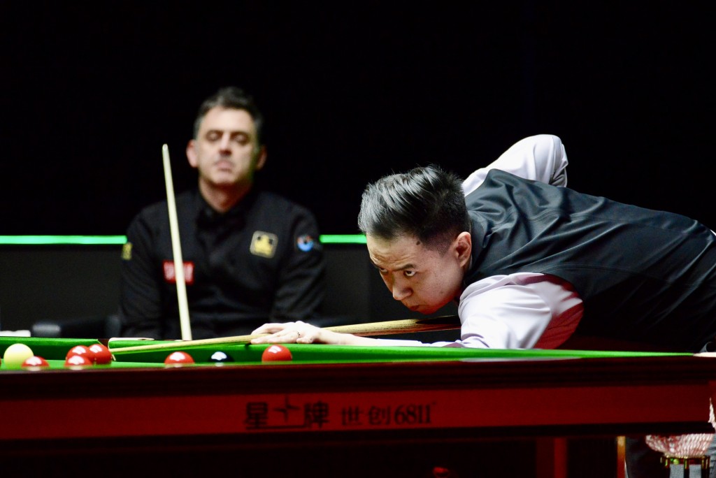 肖國棟（右）稱奧蘇利雲（左）為偶像，親手淘汰他心情複雜。楊功煜攝