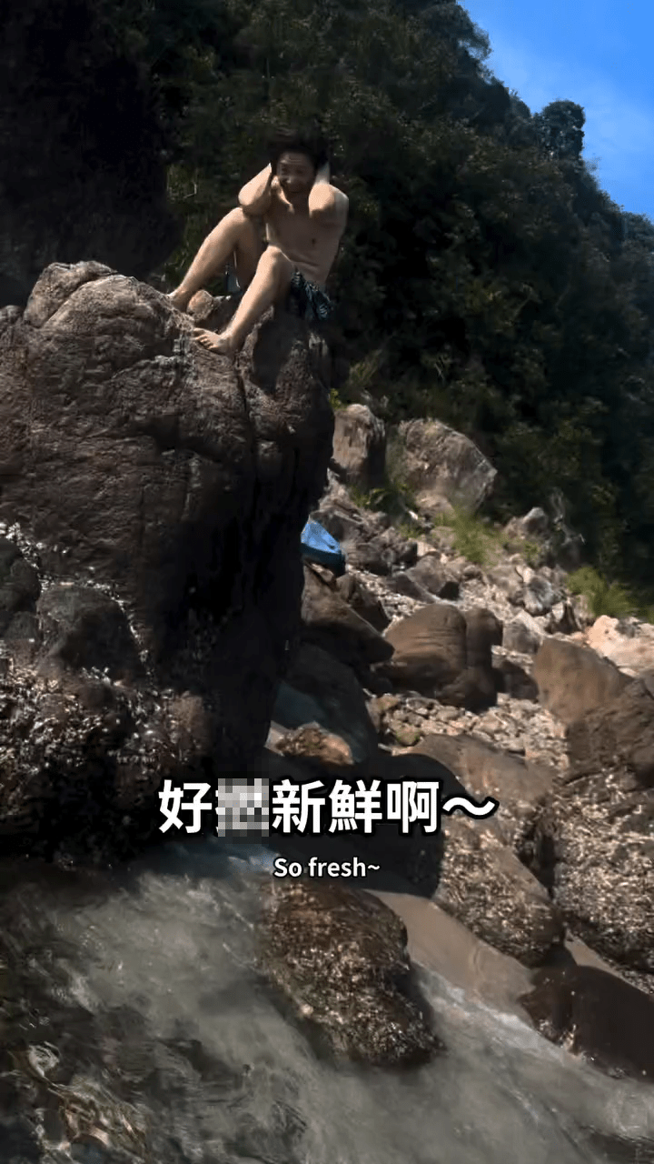 同行友人在岸邊目睹食生蠔一刻，表現出難以置信的表情。