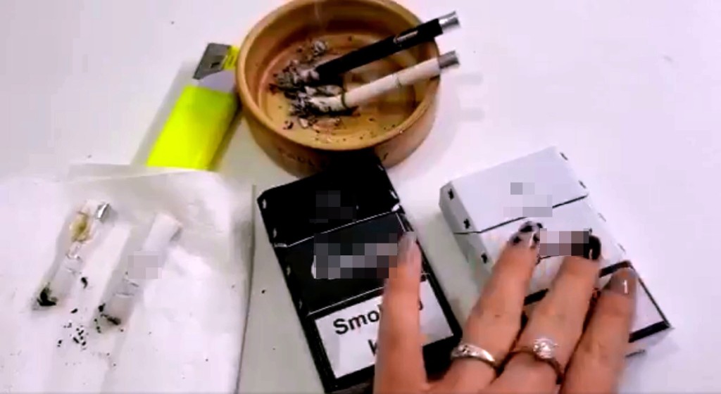 有私烟卖家在社交媒体上载宣传短片，可见女子以纤纤玉手拿起香烟。 网上图片