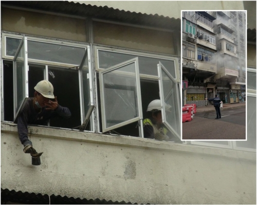 走到窗前向外揮手求助。梁國峰攝