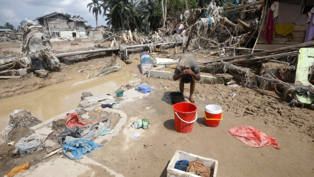 印尼洪災災區滿目瘡痍。 美聯社 印尼洪災災區滿目瘡痍。 美聯社