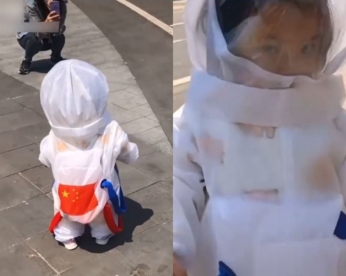 女童穿太空衣出門。網圖